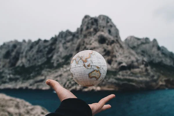 a small globe in a hand