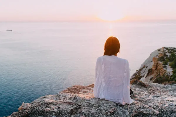 girl sitting alone and enjoying the nature 